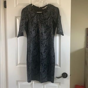 Textured black dress with leather details